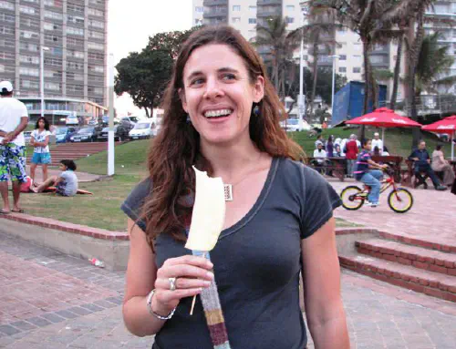 Heather eating pineapple on a stick