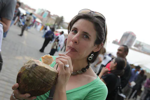 Heather drinking coconut juice on Diwali