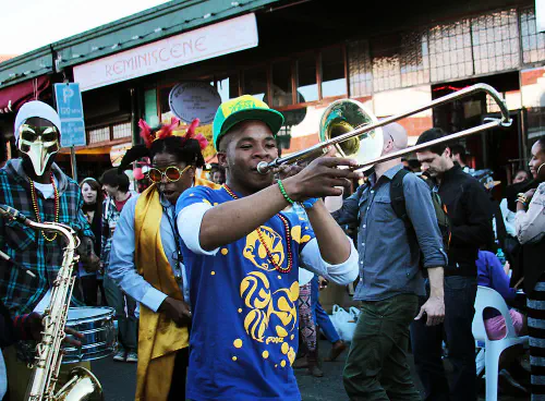 Musicians marching down 7th Street during Fete de la Musique