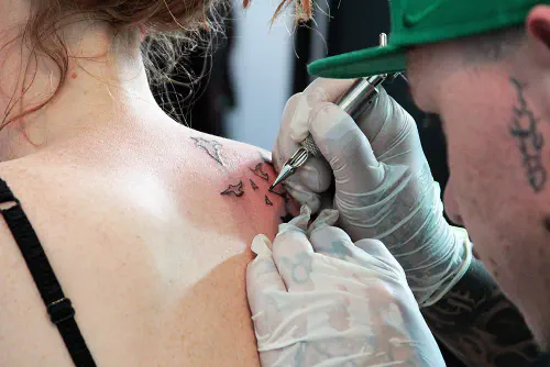 Ruth getting a tattoo