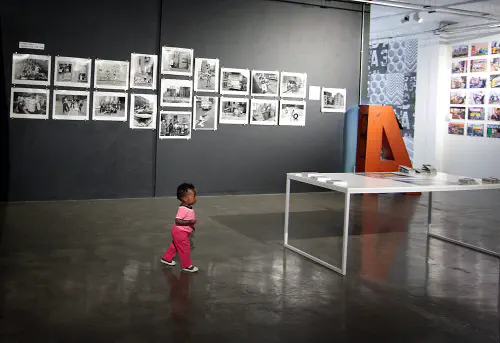Kid at a photo exhibition