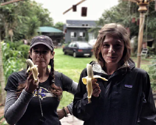 Heather and Emily eating bananas