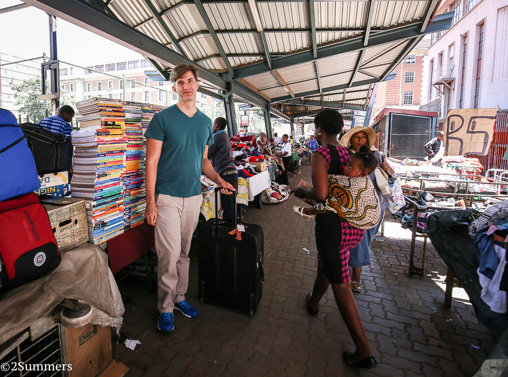 Griffin with a suitcase full of books in downtown Joburg