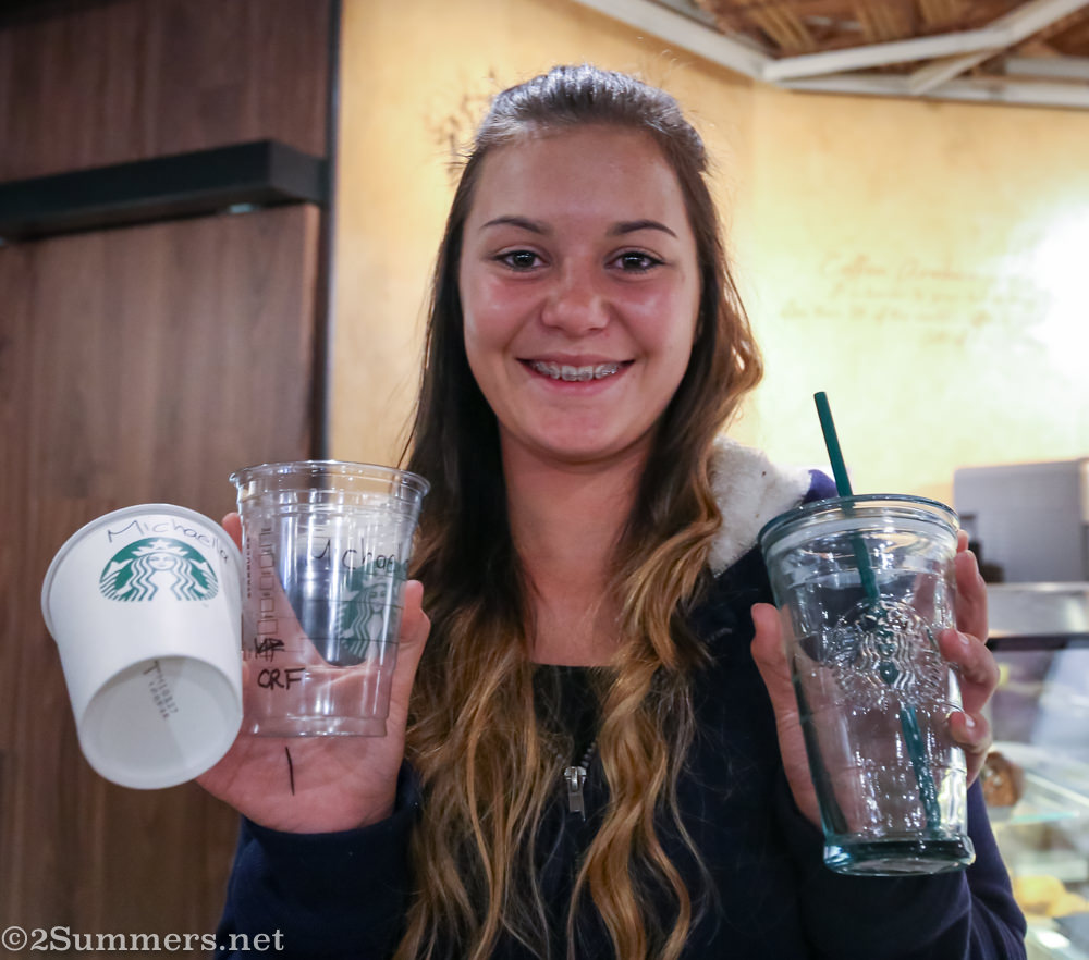 Micaela with cups in Starbucks