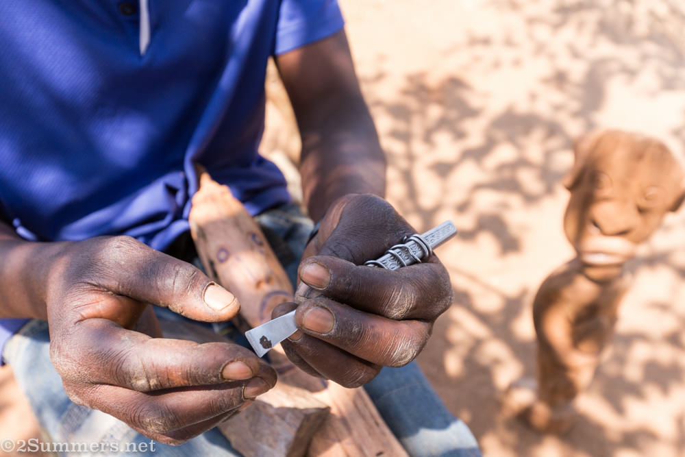 Patrick carving wood with handmade tools