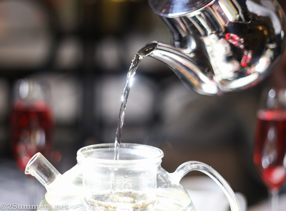 a waiter pours tea at 54 on Bath Hotel