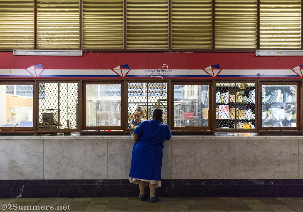 Person at post office getting mail