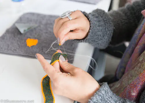 Green and orange beading at piece