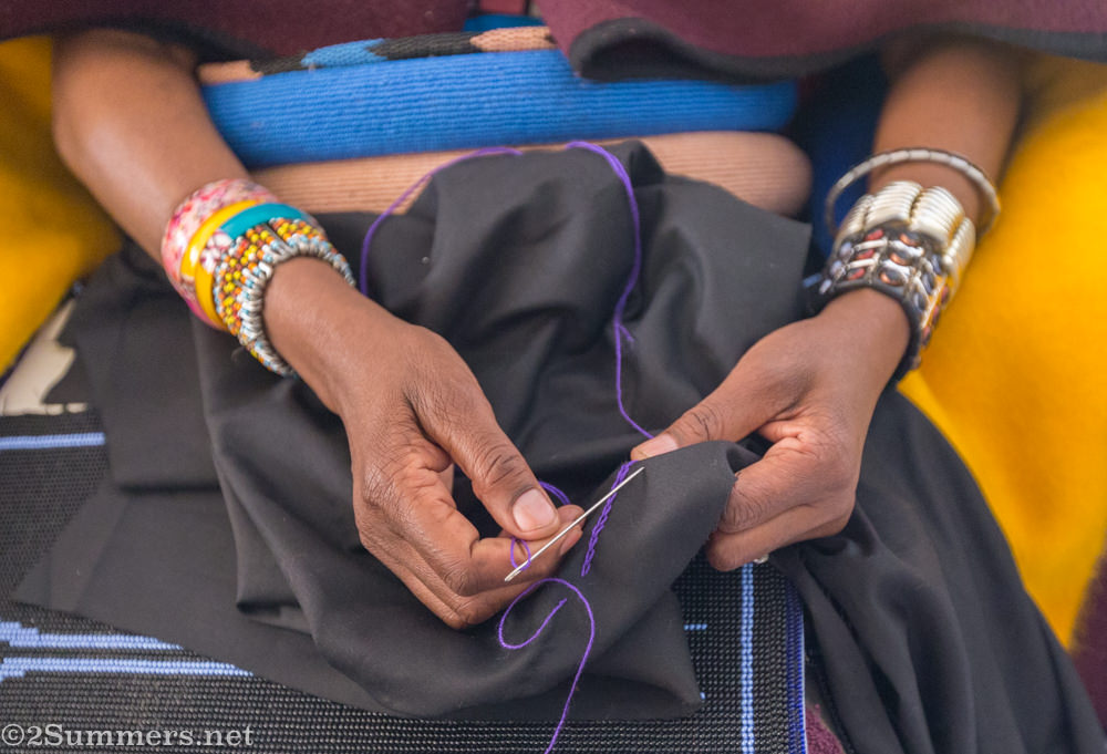 Mama Emily embroidering