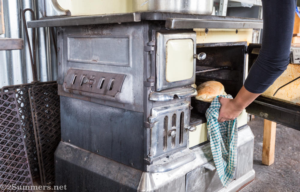 Bread coming out of the oven at Bergbron Plaaskombuis