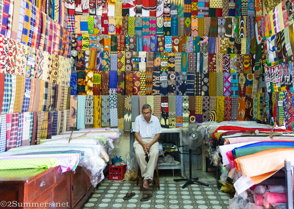 Man at Casa Elefante fabric shop in downtown Maputo.