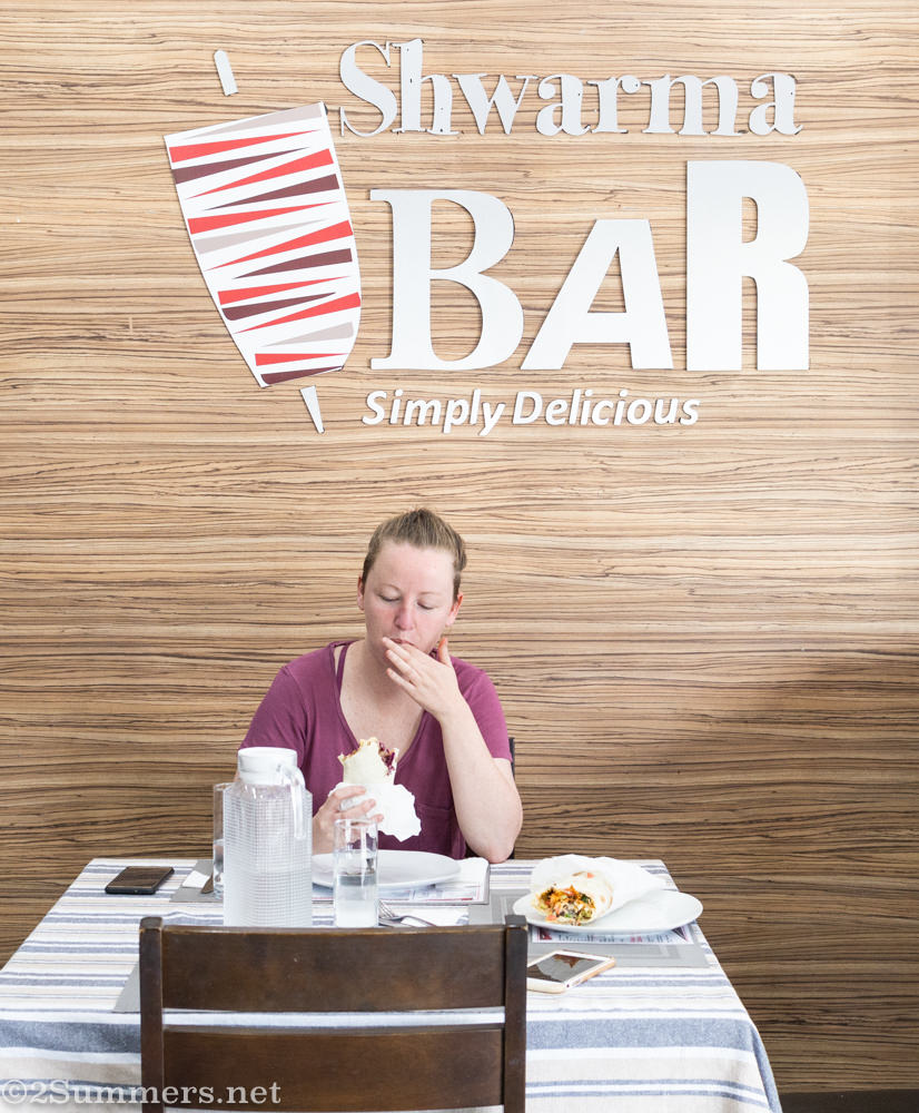 Tecla eating a laffa from the Shwarma Bar