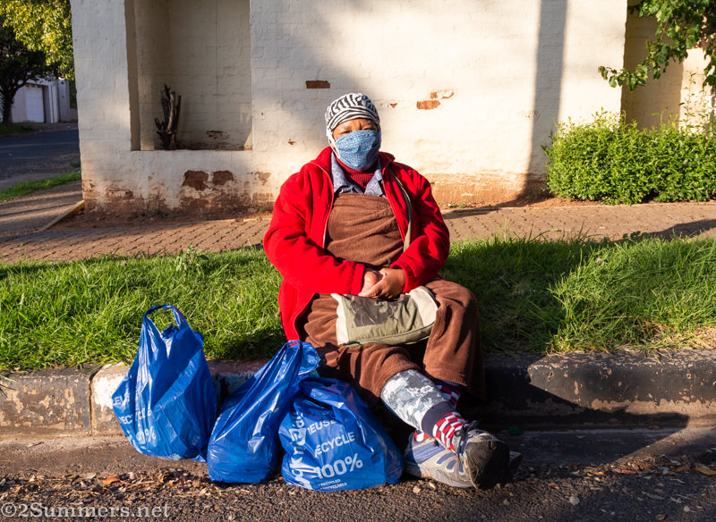 Lady waiting with parcels
