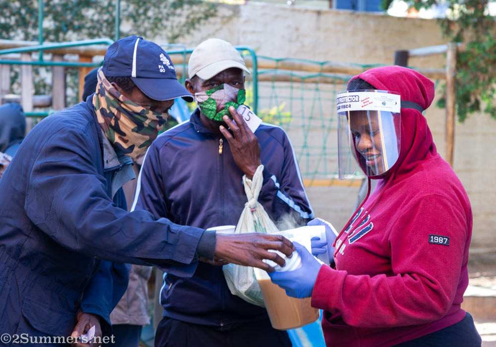 Mbali giving out coffee