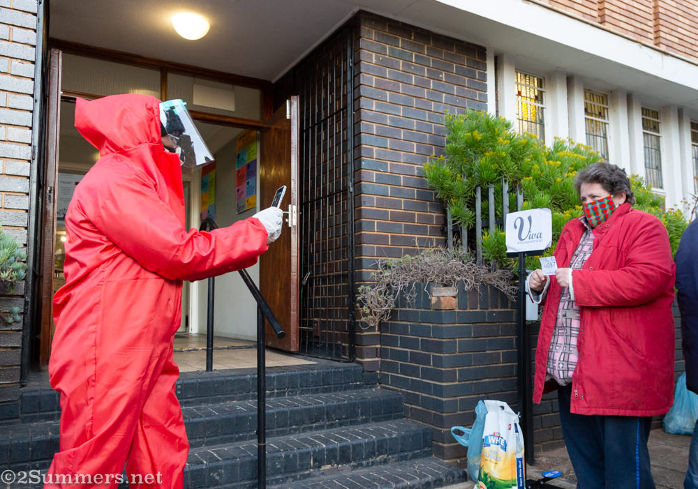 Photographing a food parcel recipient