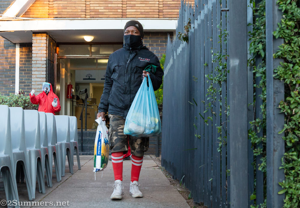 Man receiving a food parcel