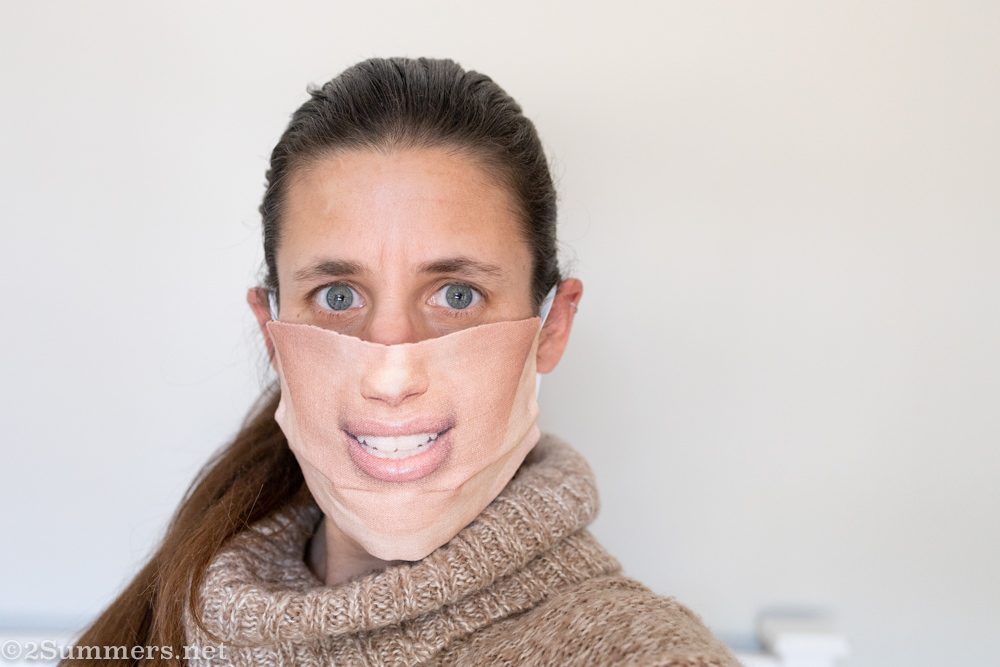 Heather wearing fake smile mask