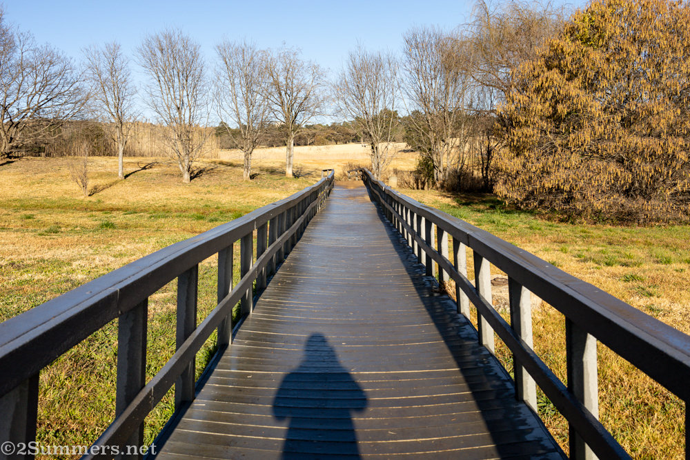 Heather crossing a bridge in Emmarentia Dam