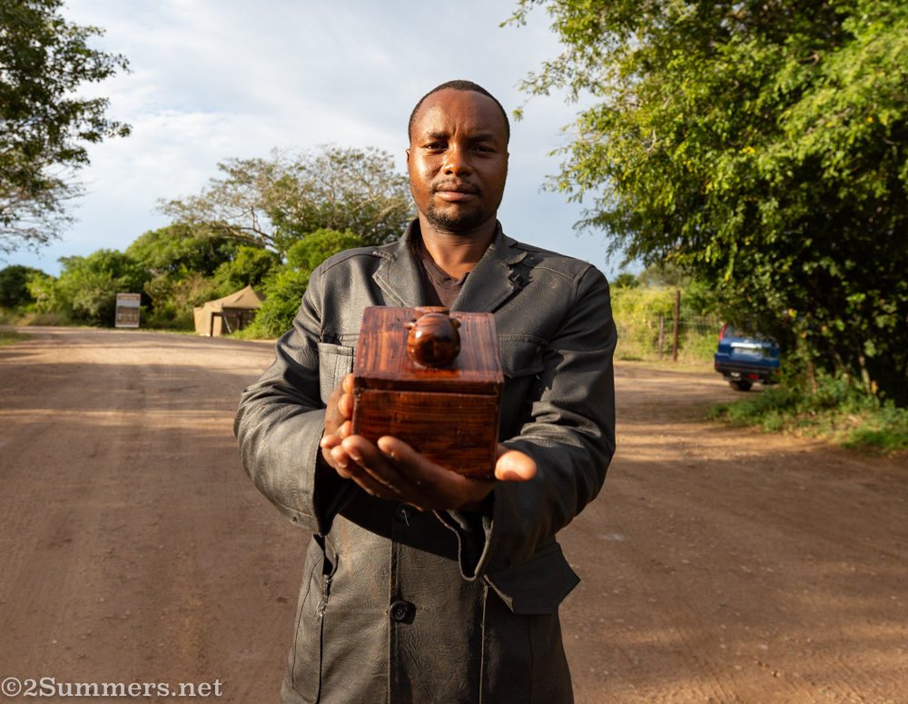 Paster with his carved dung beetle blox