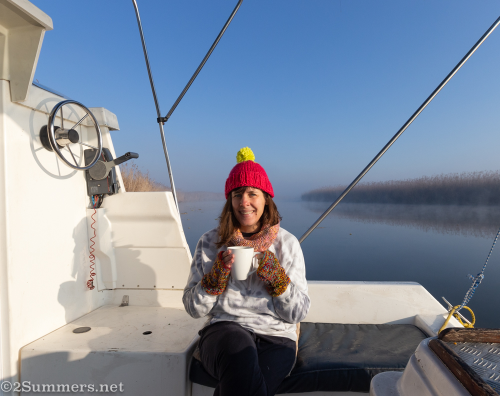 Heather bundled up on the boat