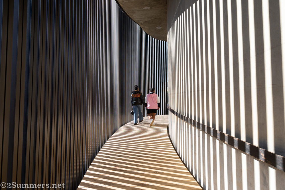 People walking up the curving walkway at CIRCA.