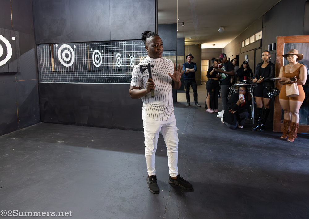 Simba explains how to throw an axe