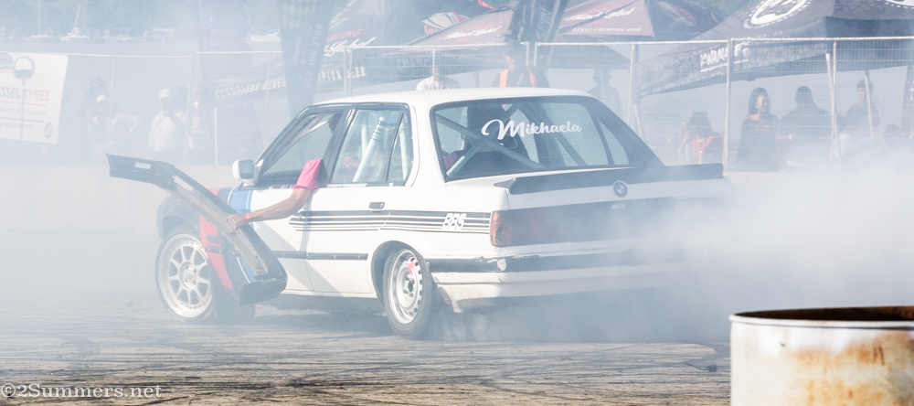 Passanger holding bumper that had fallen off the car