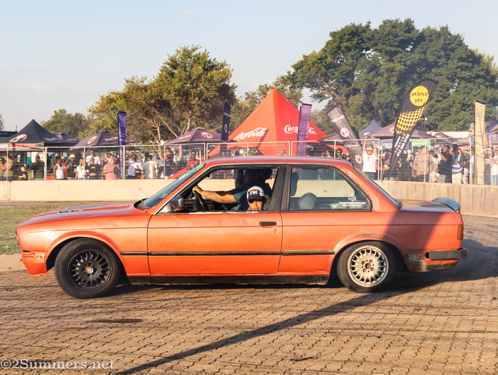 Kid looking out of orange car