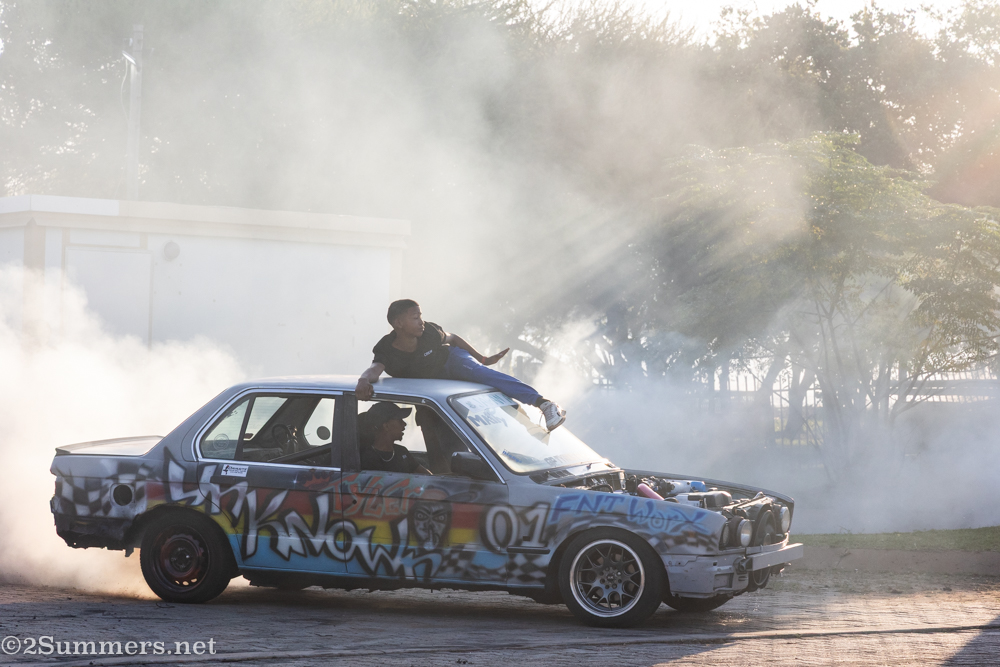 Guy on top of graffiti car