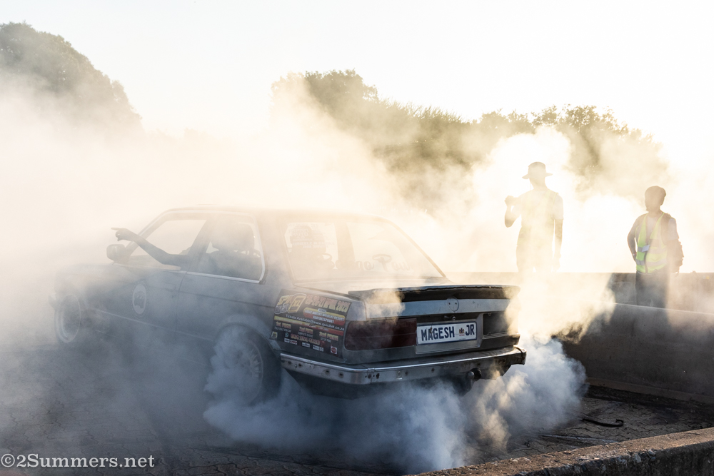 Car surrounded by smoke