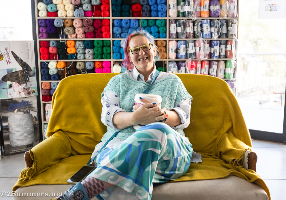 Fiver sitting in front of the yarn