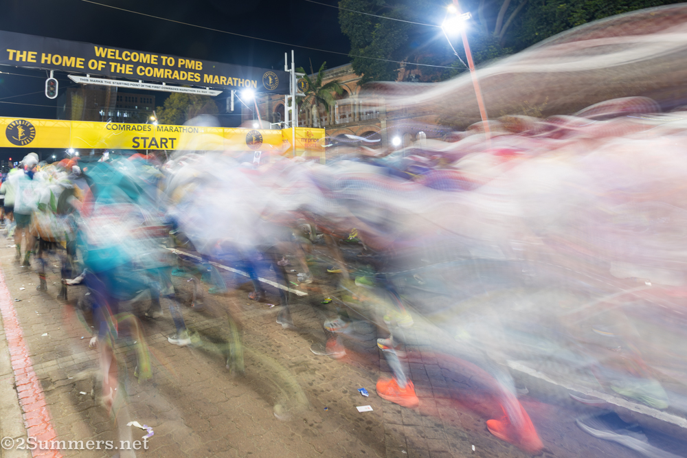 Runners stream past at the start of the race.