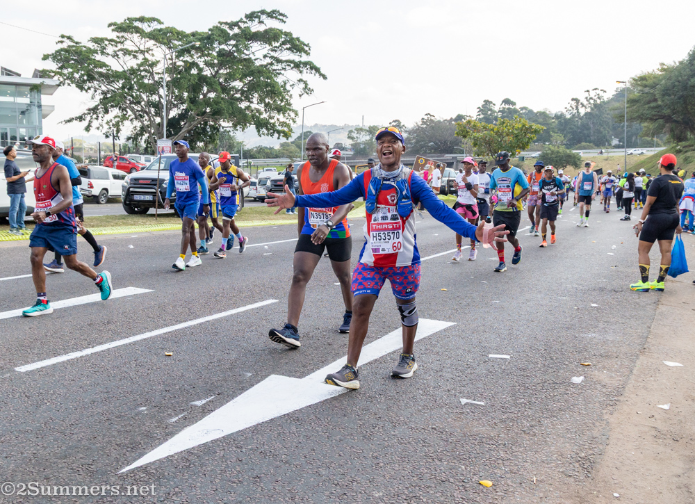 Happy guy walking up a hill