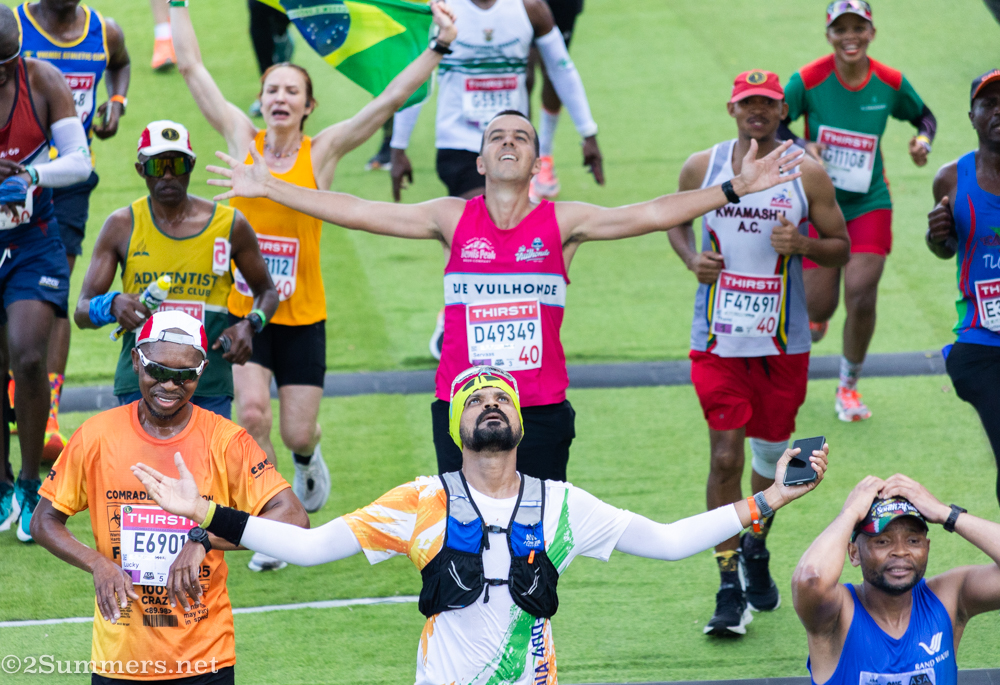 Runners celebrate as they cross the finish