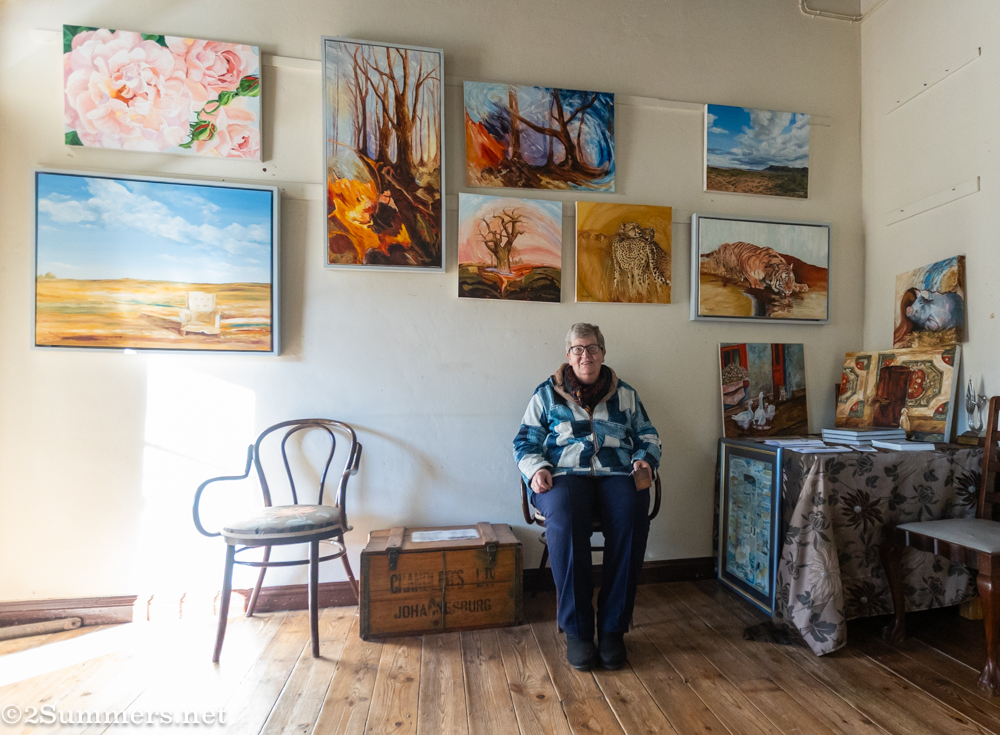 Rina Coetzee with her paintings